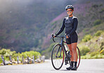 Beautiful, athletic, mixed race young woman exercising outside in the forest. Healthy and sporty female athlete out for a cycle in the wilderness. Endurance and cardio during a workout in the woods