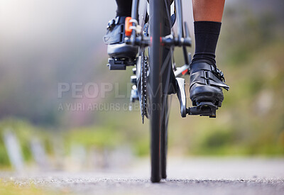 Buy stock photo Road, fitness and feet of person on bicycle in nature with health, wellness and outdoor adventure trail. Cycling, race and cyclist on mountain bike for workout, endurance challenge and shoes on pedal