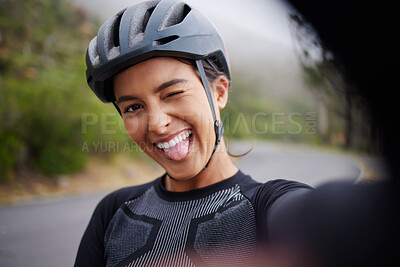 Buy stock photo Exercise, cyclist and selfie of woman in portrait for online post, sports and memory of race. Playful, tongue out and person with digital photography by road for fitness media, marathon and update