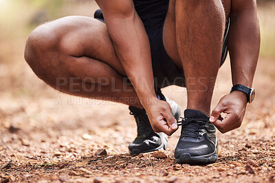 Buy stock photo Path, shoes and man getting ready for running, morning exercise and marathon training in park. Sneakers, sportswear and runner in nature tying laces with health, wellness and outdoor fitness workout