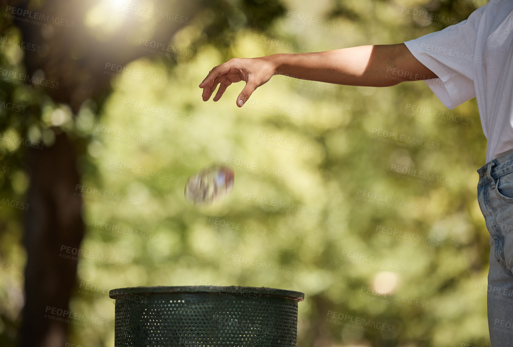 Buy stock photo Recycle, bottle and hand of person in park for sustainability, waste management and help cleaning plastic pollution. Nature, community service and volunteer with trash in garbage bin for outdoor care