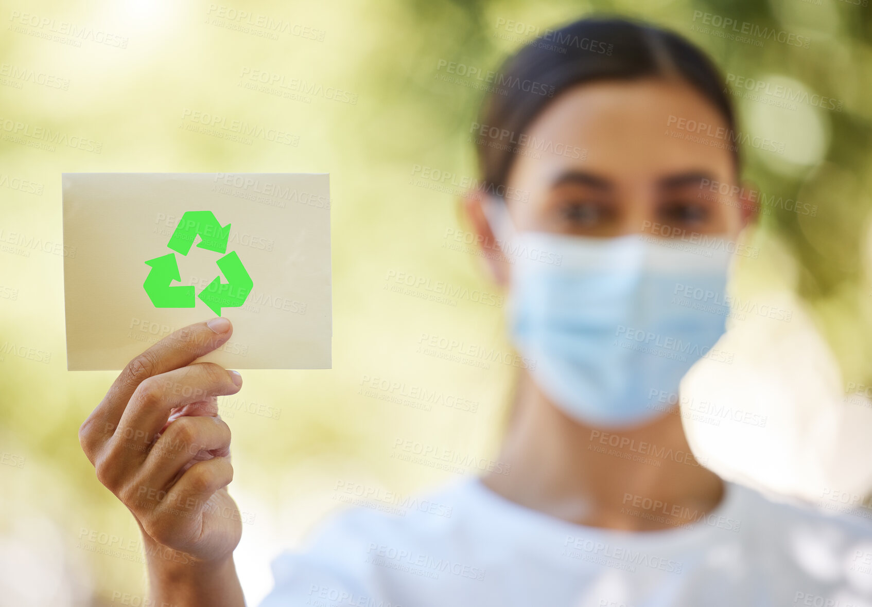 Buy stock photo Recycle, sign and woman in nature with mask for sustainability, waste management and forest care. Park, earth and volunteer with green arrow icon on card for climate change, pollution or cleaning