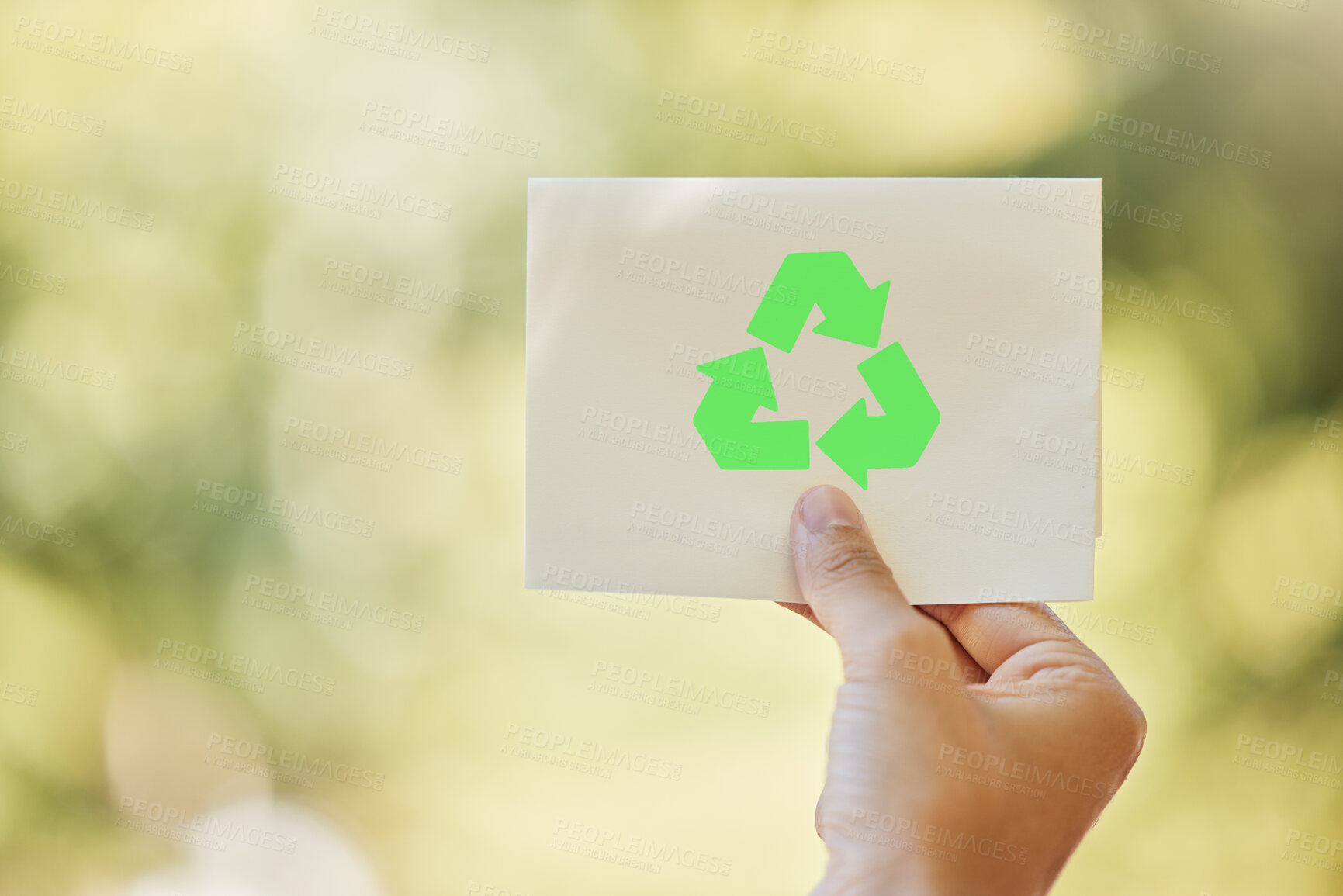 Buy stock photo Recycle, logo and hand of person in nature with sign for sustainability, waste management and forest care. Park, planet and volunteer with green arrow icon for climate change, pollution or space