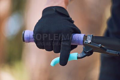 Buy stock photo Hands, closeup and brakes of man on bicycle for cycling, fitness and exercise outdoor with fingers. Cyclist, gloves and hands on steering bar for sport, mountain bike or gear in nature in competition