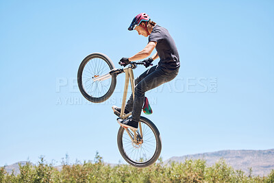 Buy stock photo Extreme sports, jump and man on bicycle for training, workout and exercise in countryside. Fitness, cycling and person with mountain bike in air for adventure, freedom and adrenaline on dirt trail