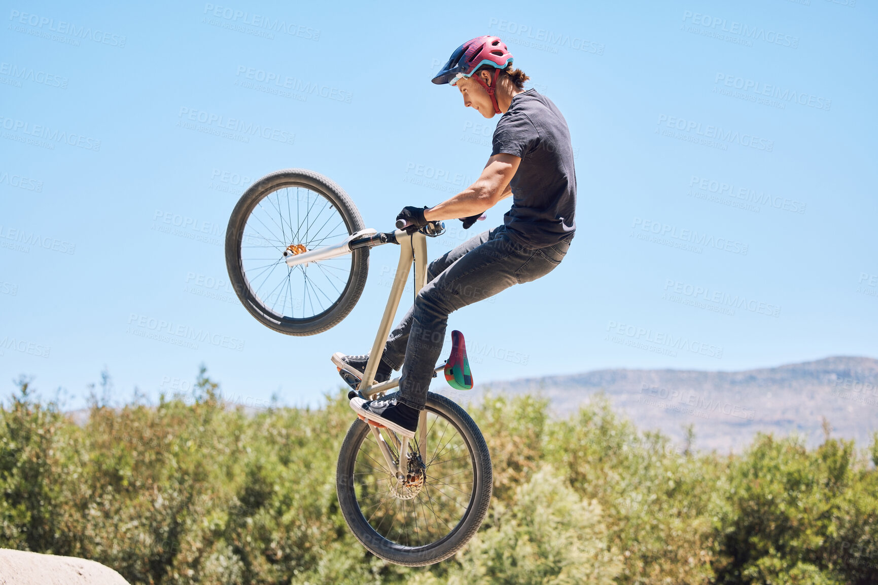 Buy stock photo Extreme sports, jump and man on bicycle for competition, workout and exercise in countryside. Fitness, cycling and person with mountain bike in air for adventure, training or adrenaline on dirt trail