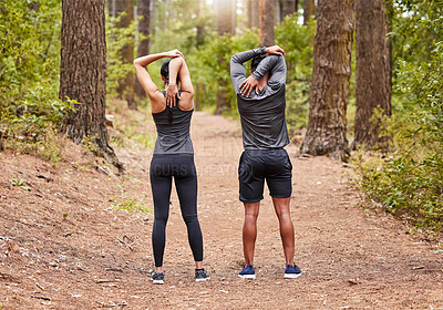 Buy stock photo Back, exercise and stretching with people in forest for start of marathon, training or workout. Fitness, health and warm up with athlete or runner couple in nature for cardio preparation together