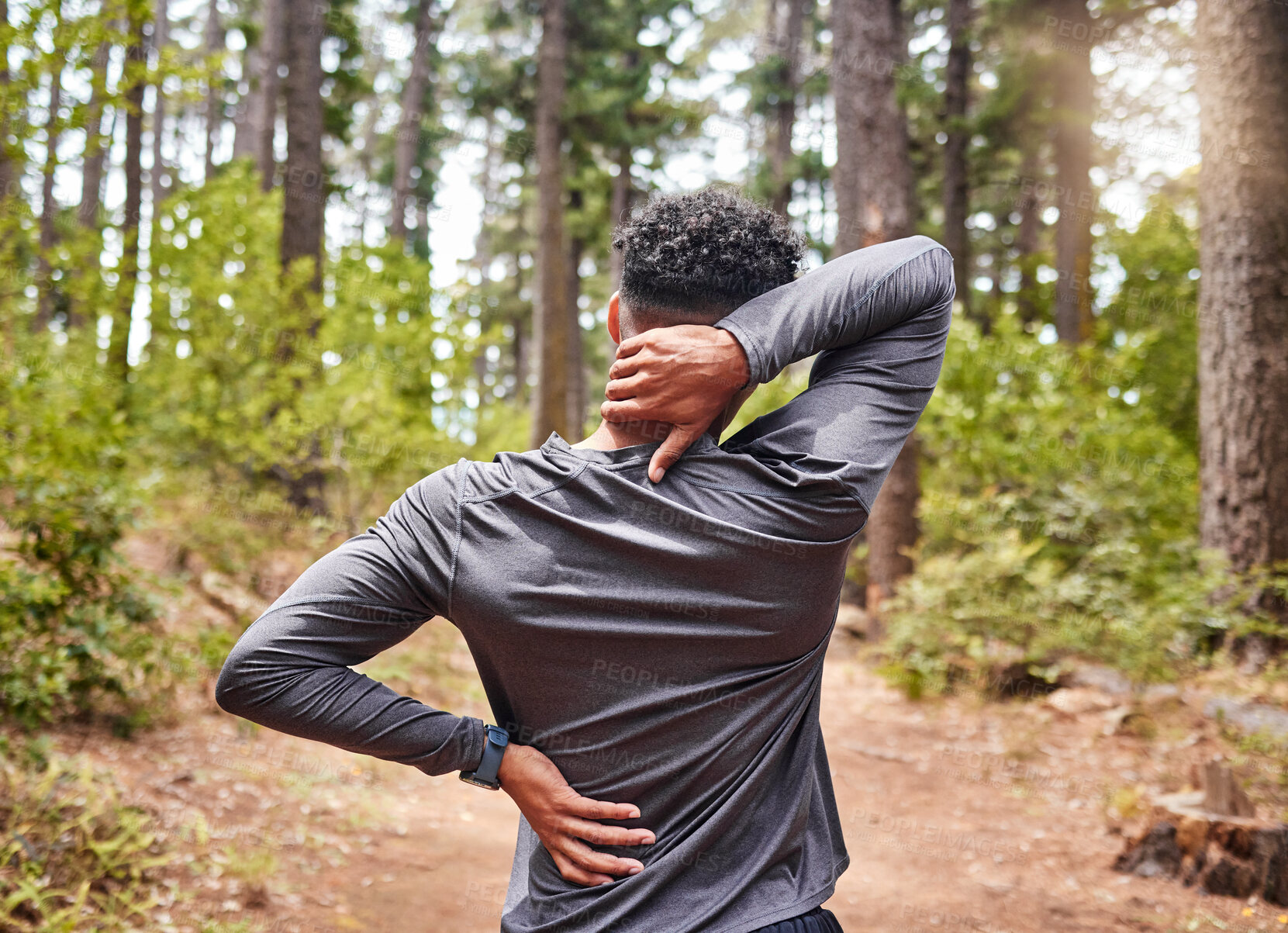 Buy stock photo Back pain, fitness and runner man in forest with injury from cardio exercise, marathon or training. Accident, anatomy and emergency with athlete or sports person outdoor in nature for activity