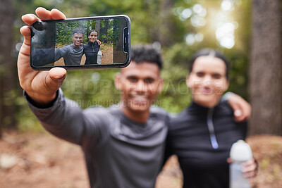 Buy stock photo Fitness, smile and screen selfie of happy couple for cardio, exercise and running or outdoor marathon training. Man, woman and profile picture for health, wellness and forest trail for fresh air