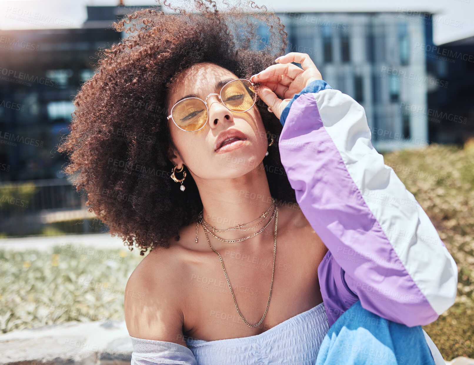 Buy stock photo Woman, city and edgy portrait with fashion, influencer and style with confidence and sunglasses outdoor. Urban, cool and African female person with gen z outfit, jewelry and eyewear with natural hair