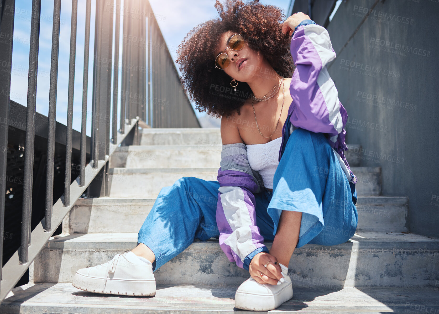 Buy stock photo Woman, portrait and fashion on urban staircase with confidence, gen z and vintage jacket outdoor. Steps, city and afro hair of an African person with trendy, hipster and retro style with cool glasses