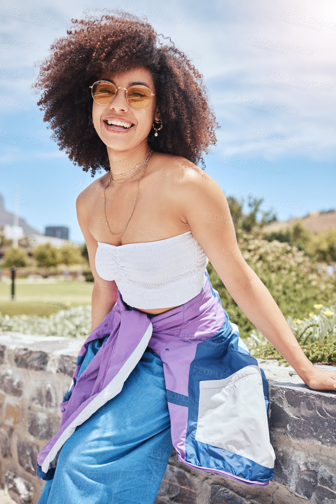 Buy stock photo City, trendy and woman in portrait for fashion, stylish and hipster with confidence in Spain. Outdoor, female person and curly hair with cool sunglasses on vacation, holiday and smile for accessory