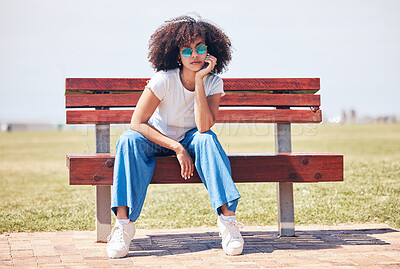 Buy stock photo Fashion, sunglasses and African girl on park bench for trendy, style or vision at garden. Confident woman, cool and relax outdoor with streetwear, reflection and accessory on summer holiday in USA