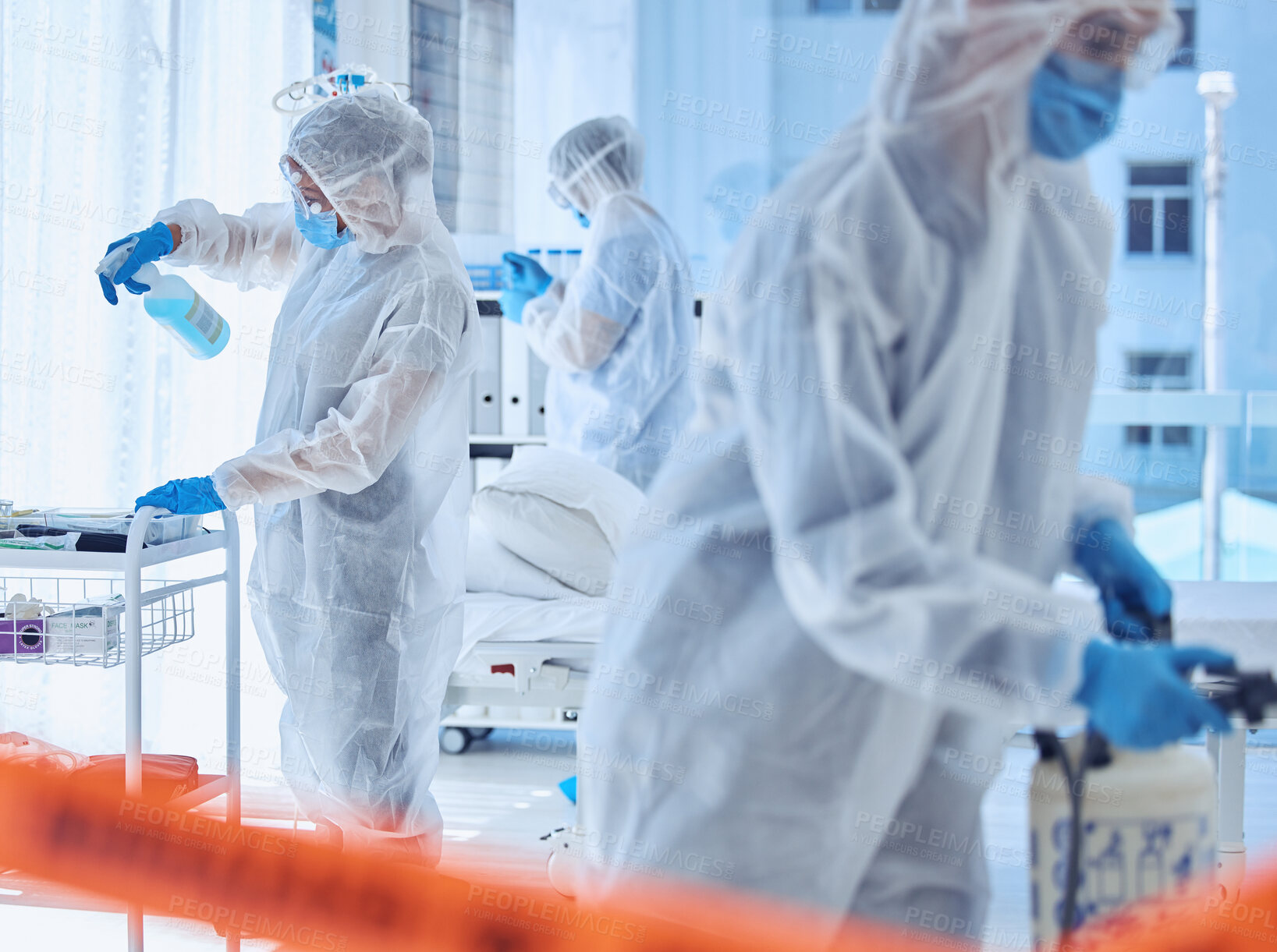 Buy stock photo Hospital, biohazard and people cleaning with equipment for contamination, safety and protocol. Medical, red tape and work with PPE in ward for healthcare disinfection, sanitation or infection control