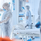 Biohazard team cleaning a medical hospital. Csi team in hazmat suits ...