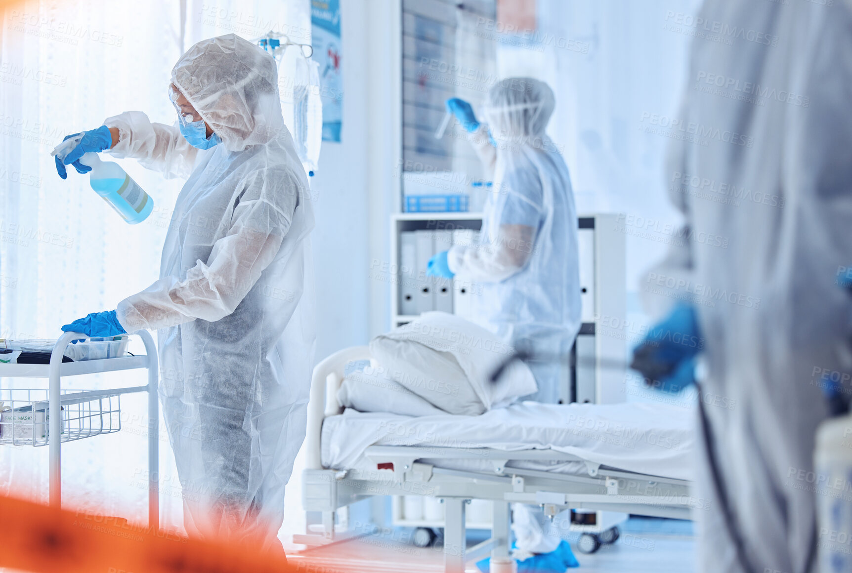 Buy stock photo Hospital, contamination and people cleaning with disinfection for biohazard, safety or protocol. Red tape, medical and work with PPE in ward for healthcare compliance, sanitation or infection control