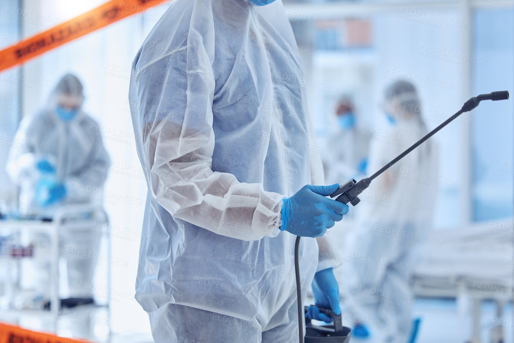 Buy stock photo Medical, biohazard and people with disinfection in hospital for contamination, cleaning and protocol. Red tape, protection and work with PPE in ward for healthcare, sanitation and infection control