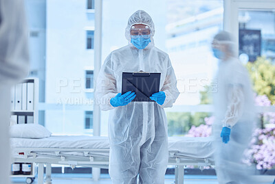 Buy stock photo Doctor, ppe and person with report in hospital for quarantine, healthcare or covid. Medical scientist, protective suit or document for treatment protocol, research or busy reading clipboard with blur