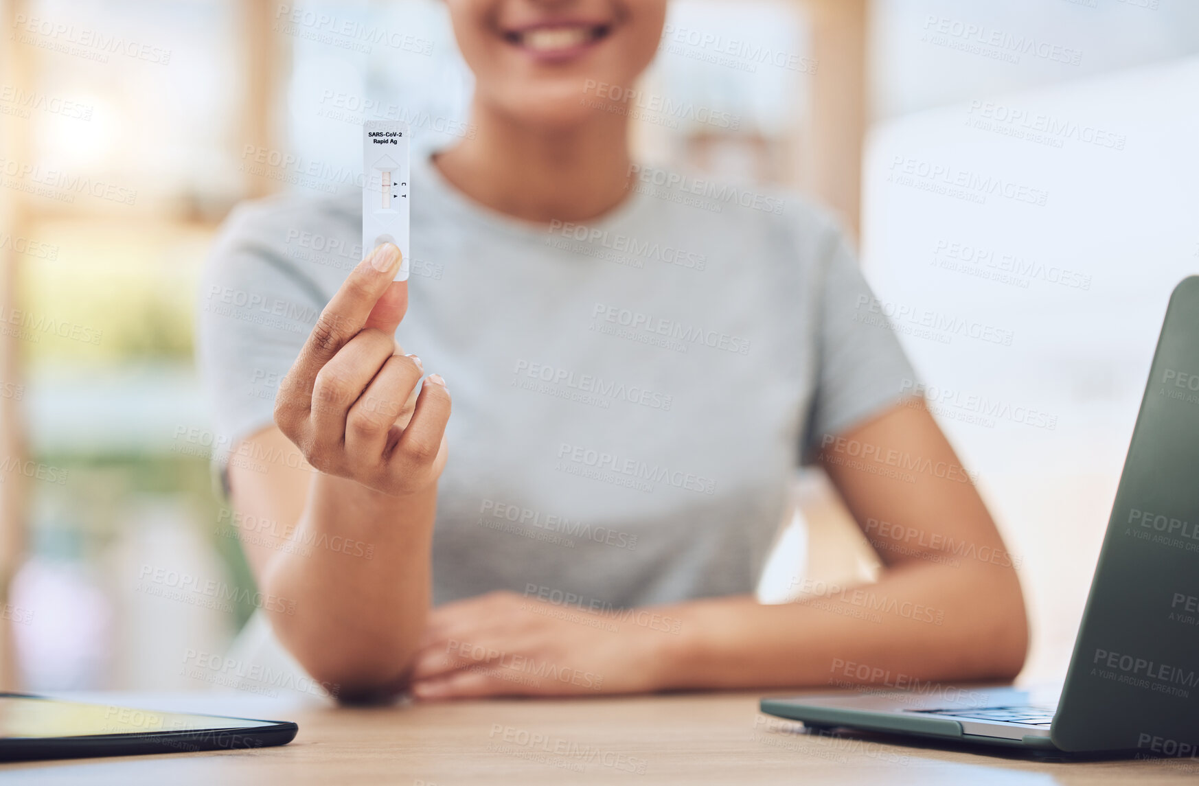 Buy stock photo Hand, woman and covid with test kit in office for antigen exam, negative results and compliance of virus safety. Person, medical and healthcare product for covid19, insurance and pcr sample of health