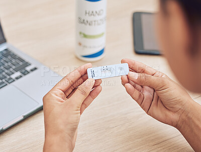 Buy stock photo Woman, hands and covid with rapid test for results, medical exam or healthcare on office desk. Closeup of female person or employee with corona virus kit for protection, health or safety at workplace