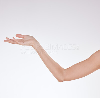 Buy stock photo Hand, soft and skincare in studio, arm and shine with treatment in space, smooth and clean with routine. White background, reaching out and person with results of dermatology, cosmetics and mockup