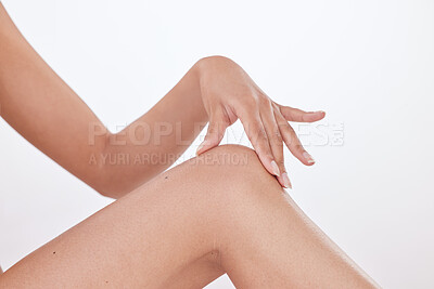 Buy stock photo Woman, hair removal and smooth knee in studio for skincare, beauty and soft touch on white background. Female person, epilation and grooming results for maintenance, dermatology and cosmetics glow