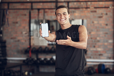 Buy stock photo Phone, screen and portrait of man in gym for fitness app, membership or offer to download. Happy, person and point at tech with mockup space for exercise program, training or online registration info