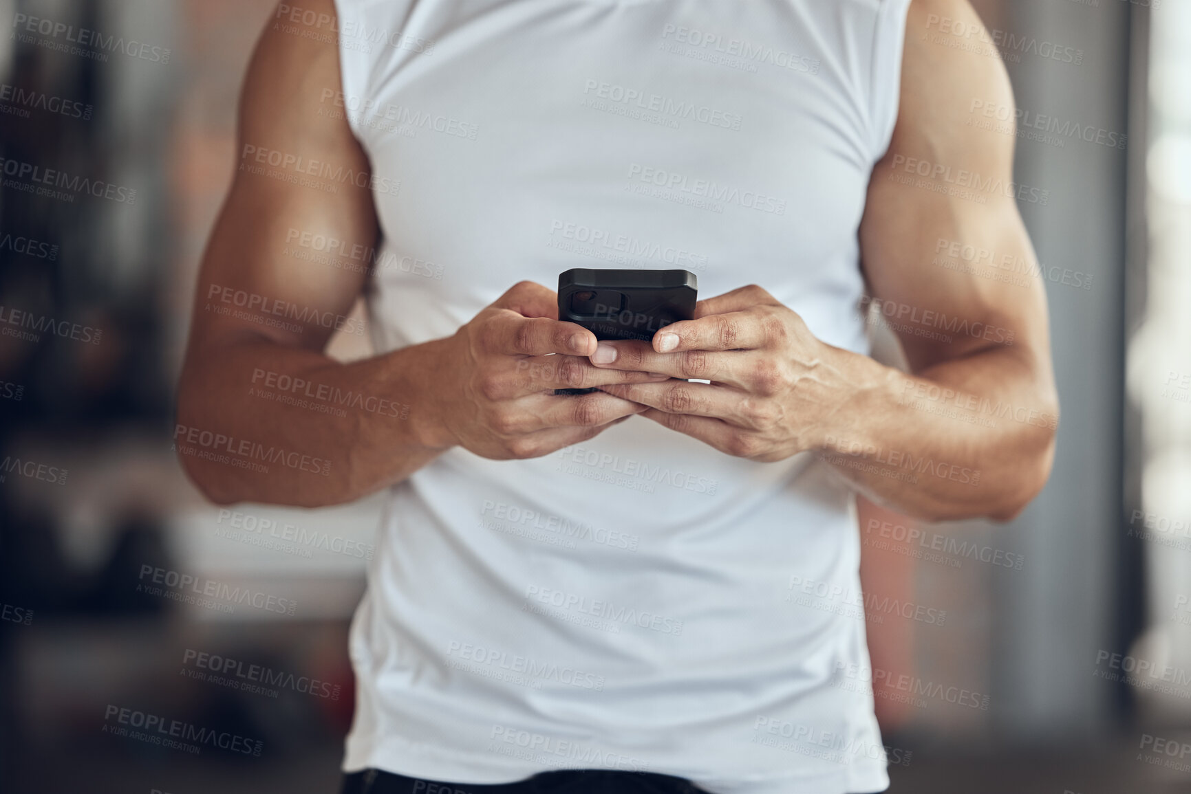 Buy stock photo Fitness, man and hands with phone at gym for tracking workout progress, exercise app or typing text message. Athlete, person and smartphone at sports club for training website or online wellness tips