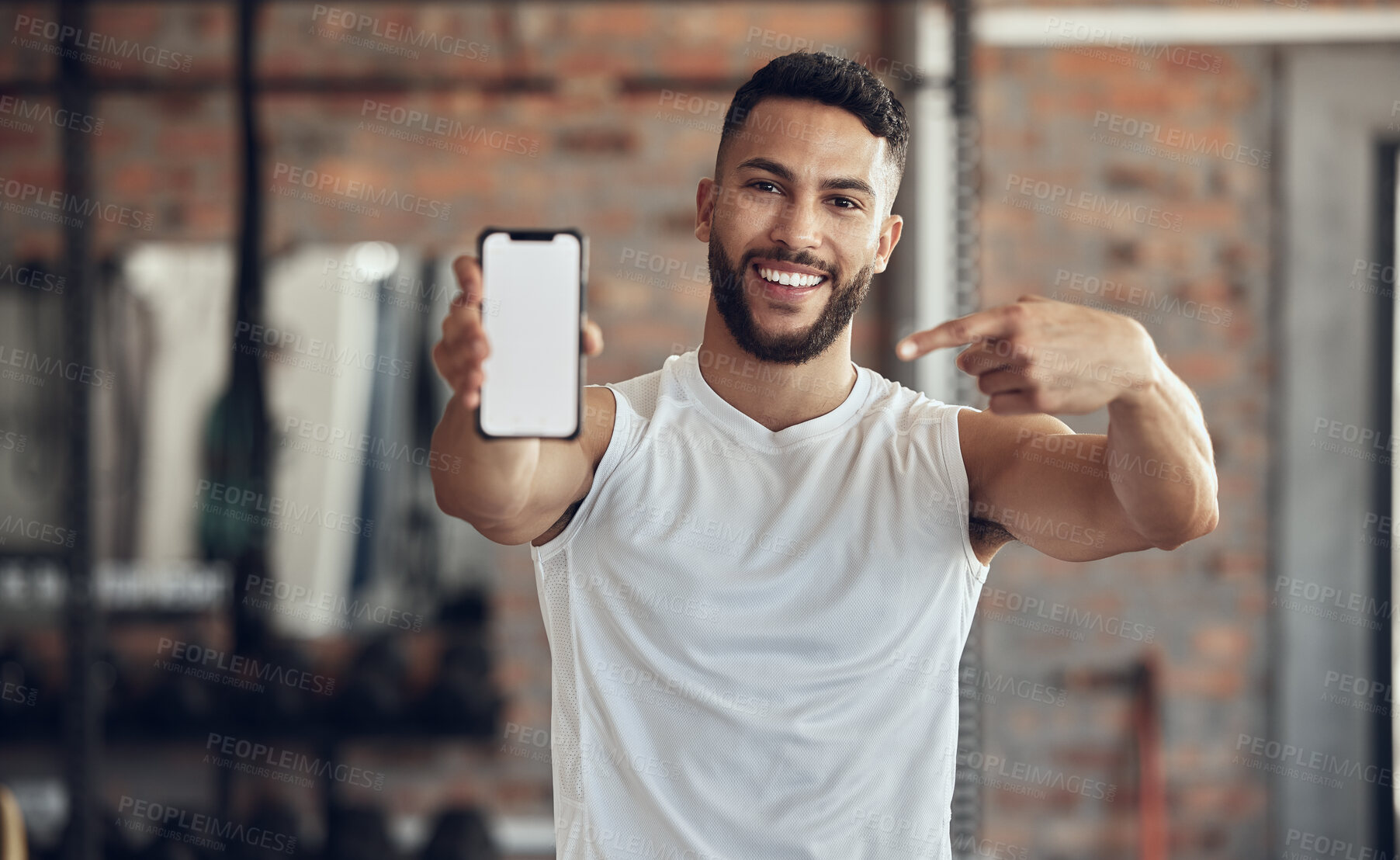 Buy stock photo Phone screen, smile and portrait of man in gym for exercise app, membership and software download. Person, point and tech with mockup space for fitness program, training and online registration info