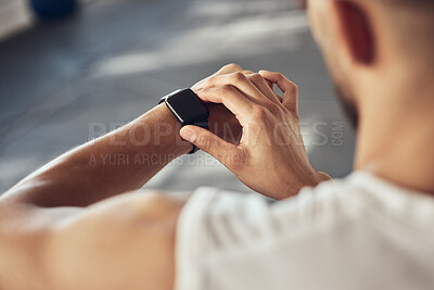 Buy stock photo Man, fitness and checking with smart watch for tracking, performance or progress on workout at gym. Closeup of male person or athlete with wristwatch for training app, sync or tracker at health club