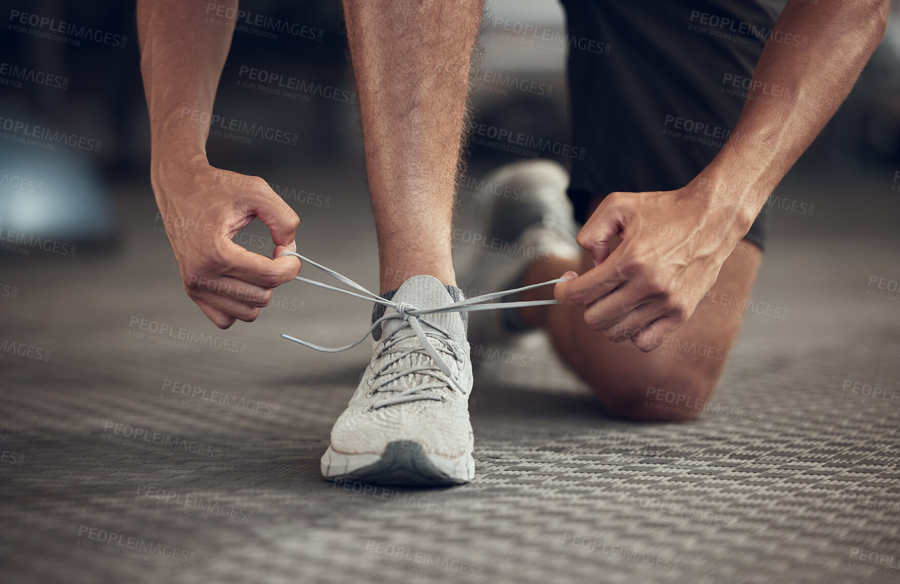 Buy stock photo Man, fitness and tying shoes with laces at gym in preparation for running, workout or exercise. Closeup of male person, runner or athlete tie sneakers and getting ready for training at health club