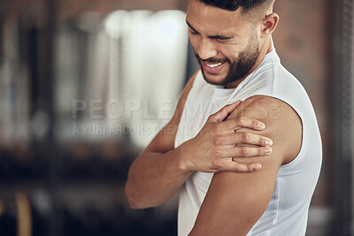 Buy stock photo Frustrated man, fitness and arm pain with muscle tension from pain, accident or inflammation at gym. Male person with sore shoulder, joint or sprain in discomfort from workout or indoor exercise