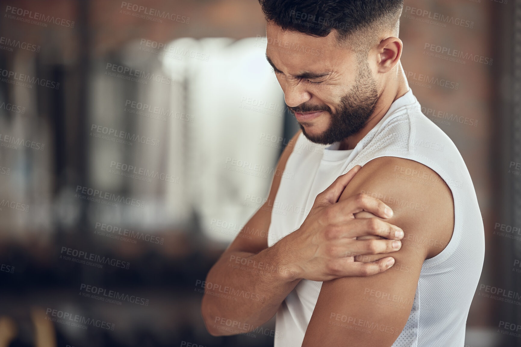 Buy stock photo Frustrated man, fitness and arm injury with muscle tension from pain, accident or inflammation at gym. Male person with sore shoulder, joint or sprain in discomfort from workout or indoor exercise