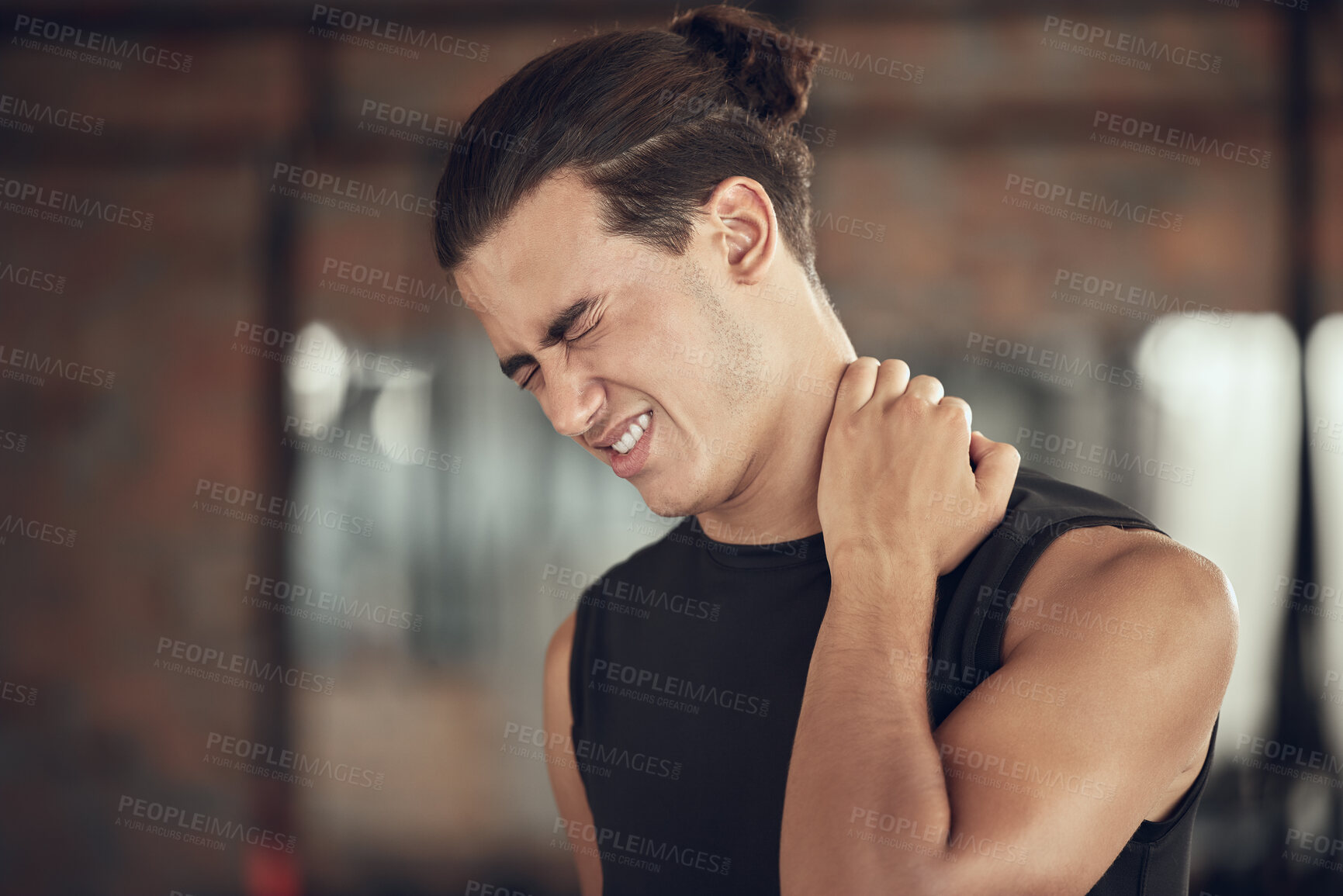 Buy stock photo Frustrated man, fitness and neck pain with muscle tension from injury, accident or inflammation at gym. Male person with sore spine, joint or sprain in discomfort from workout or indoor exercise