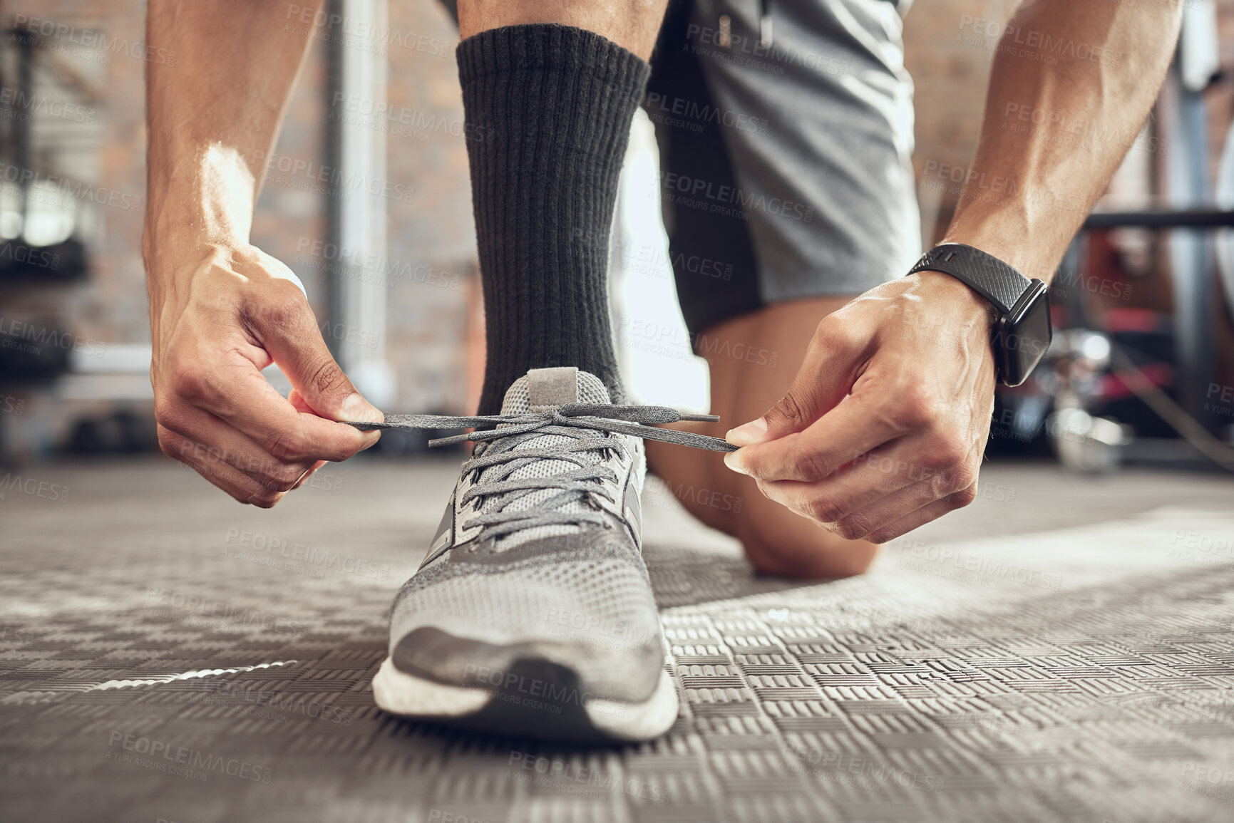 Buy stock photo Man, fitness and tying sneakers with laces at gym in preparation for running, workout or exercise. Closeup of male person, runner or athlete tie shoes and getting ready for training at health club