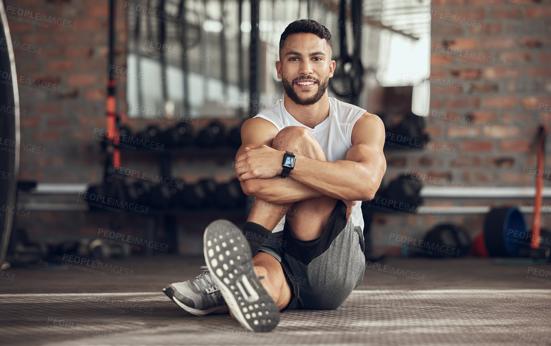 Buy stock photo Happy man, portrait and stretching with fitness on floor at gym for workout, exercise or training. Active male person or young athlete with smile for body warm up, practice or wellness at health club