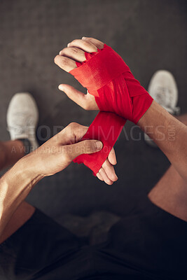 Buy stock photo Man, boxer and wrapping hand with bandage above for self defense, fight or workout at indoor gym. Top view or closeup of male person or fighter with strap on knuckles for boxing saftey or protection