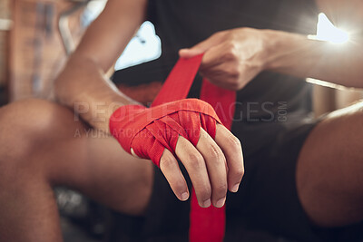 Buy stock photo Man, boxer and wrapping gloves with bandage for self defense, fight or workout at indoor gym. Closeup of active male person or fighter with strap on hands or knuckles for boxing safety or protection