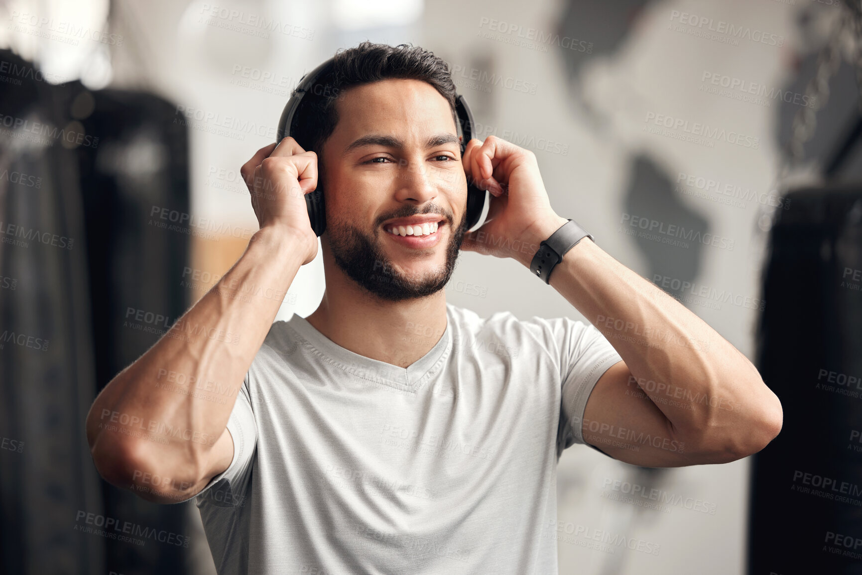 Buy stock photo Listening, headphones and man with smile, gym and music for training, exercise and fitness in morning. Calm, athlete and person with audio for workout, happy and streaming of sound with tech and app