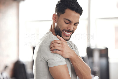 Buy stock photo Exercise, stress and man with shoulder pain for in gym for training, discomfort or joint problem. Frustrated, athlete and person with fitness emergency for bursitis, inflammation or injury in workout