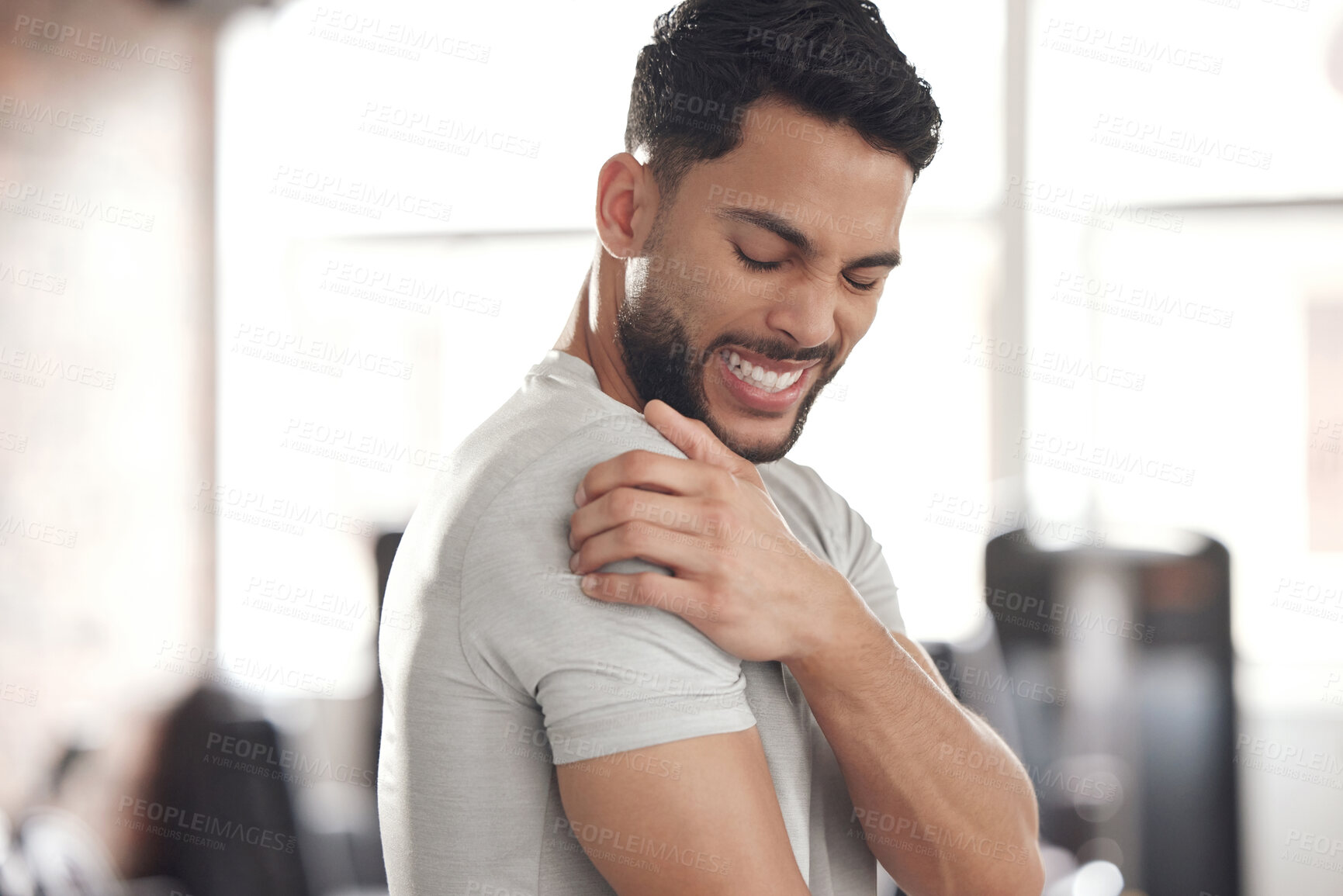 Buy stock photo Exercise, stress and man with shoulder pain for in gym for training, discomfort or joint problem. Frustrated, athlete and person with fitness emergency for bursitis, inflammation or injury in workout