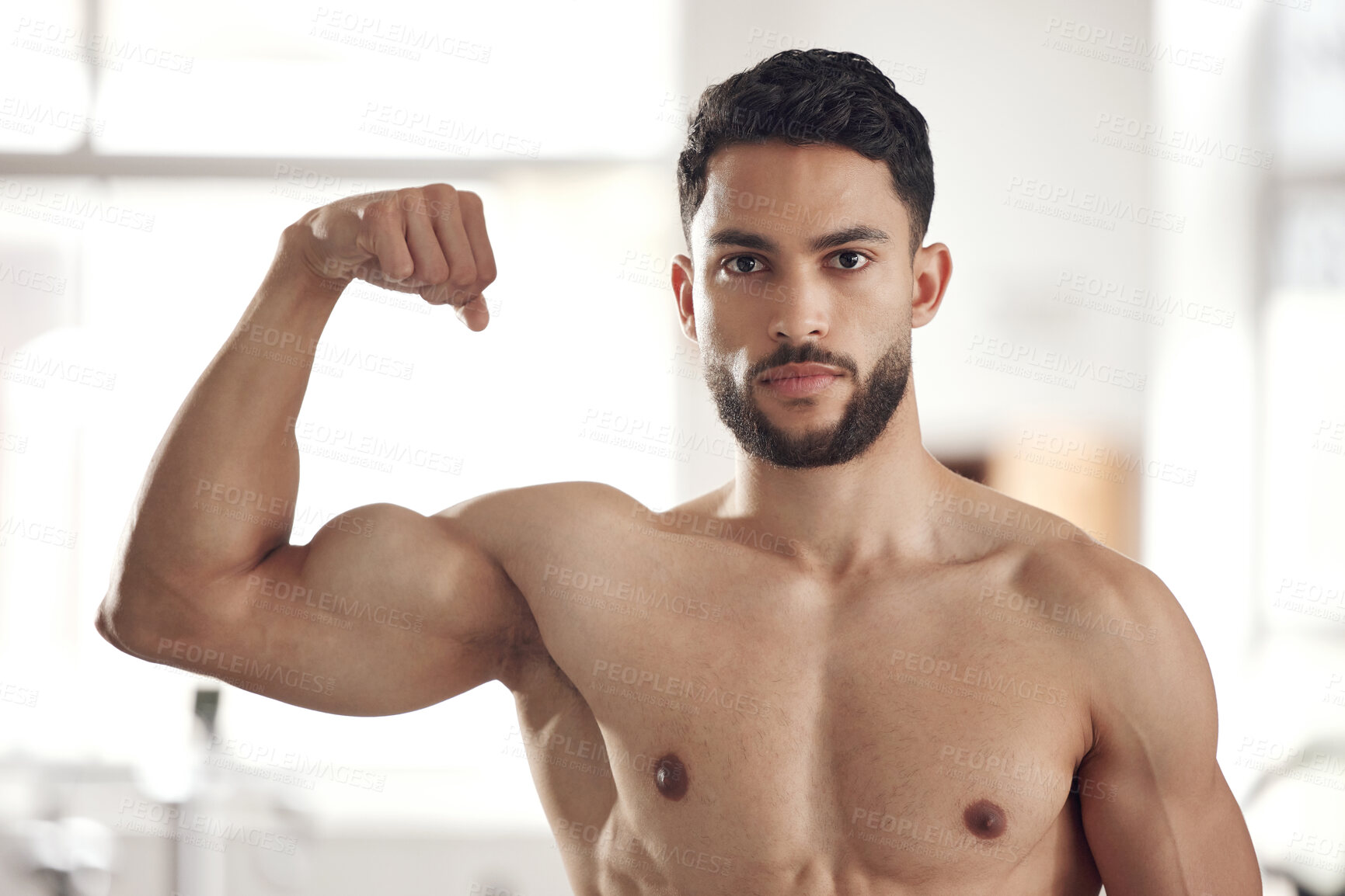 Buy stock photo Portrait, man and flex muscle for fitness, pride or workout progress with shirtless athlete in gym. Face, bodybuilder and show strong bicep for power, confidence or serious results for healthy growth