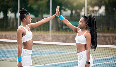 Buy stock photo Happy woman, tennis and high five with net for match, game or sport together at outdoor court. Young female person or friends touching hands with smile in success for practice, training or fitness