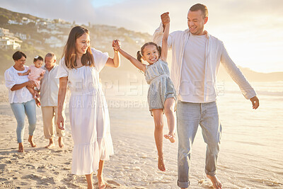 Buy stock photo Beach, family and parents swing child on vacation, adventure or getaway together for bonding by sea. Happy, generations and children with grandparents and mom and dad for fun by ocean on holiday.
