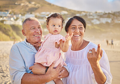 Buy stock photo Grandparents, girl and happy at beach with pointing for bonding, care and love in Mauritius. Outdoor, people and smile with kid for support at seaside on holiday, journey and travel for memories