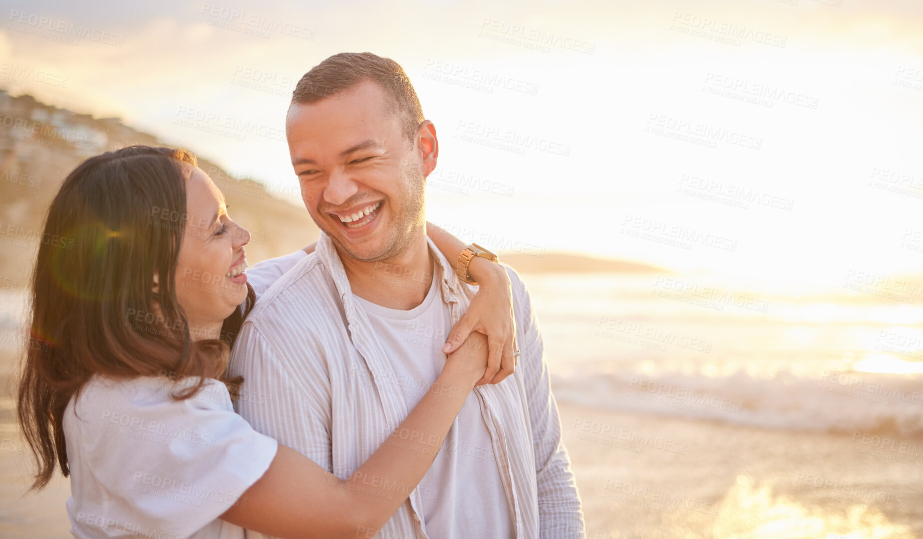 Buy stock photo Smile, couple and hug on beach with love, bonding and romance date for tropical travel in Greece. Happy, woman and man laughing with embrace of relationship, funny joke and loyalty for ocean sunset