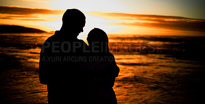 Buy stock photo Couple, silhouette and hug on beach with love, bonding and romance date for tropical travel for marriage. Smile, woman and man with embrace shadow of relationship, sunset and loyalty of ocean outdoor