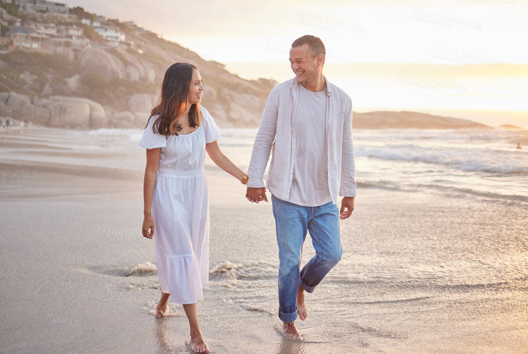 Buy stock photo Couple, happy and holding hands on beach with love, bonding and romance date for marriage travel of trust. Smile, woman and man for walking on sand, relationship loyalty and tropical ocean of holiday