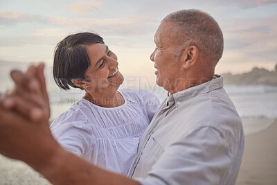 Buy stock photo Happy, mature couple and dancing on beach with love, bonding and romance date for retirement travel. Smile, woman and man with embrace fun of relationship, commitment and loyalty on ocean outdoor