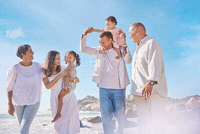 Buy stock photo Happy family, parents and beach with children or grandparents for bonding, holiday or outdoor weekend together. Generations or kids walking by ocean coast with blue sky in sunshine for summer by sea